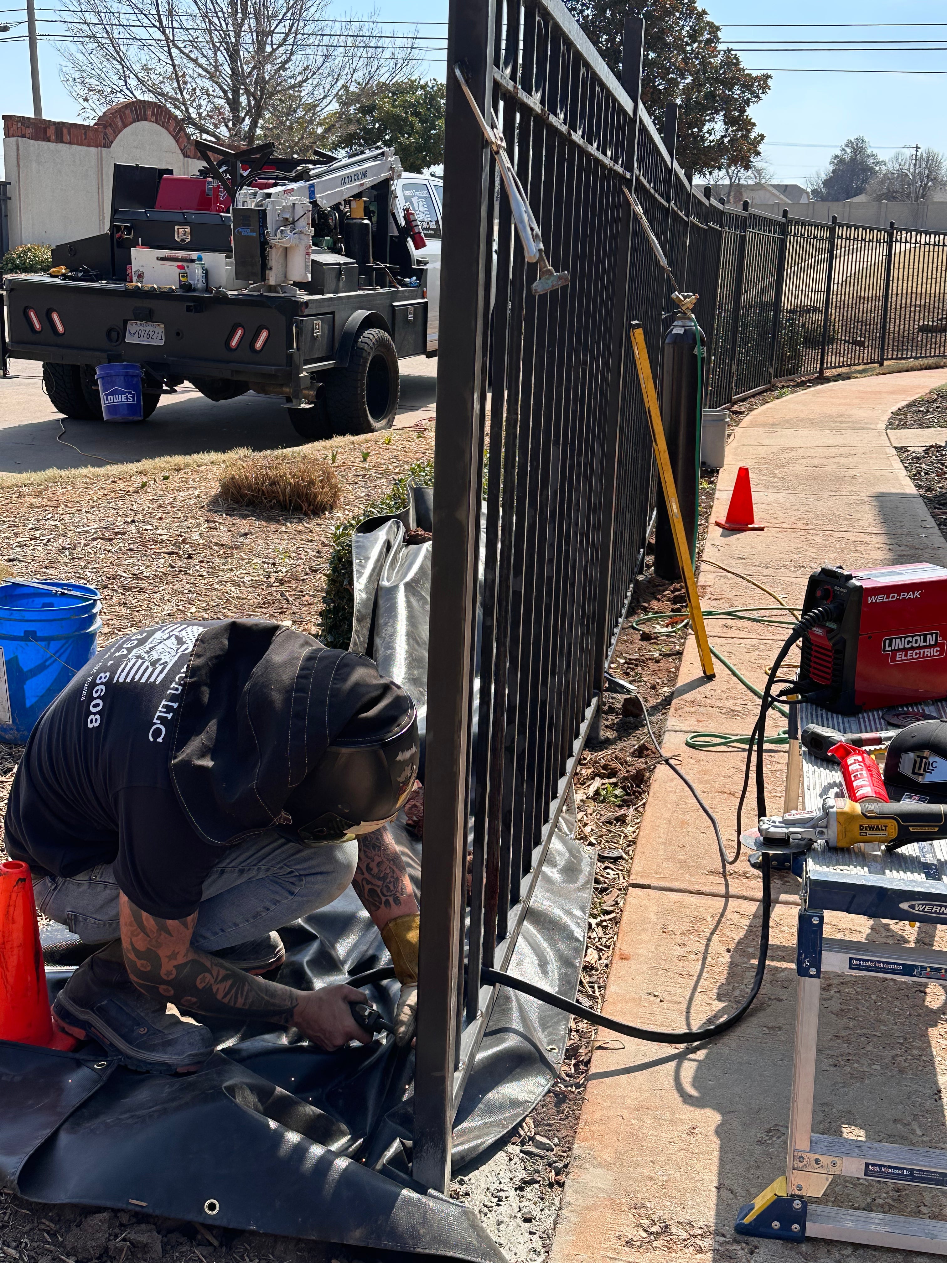 Mobile welding service truck and field equipment on a commercial repair site.